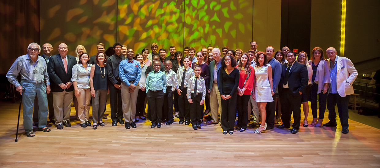 A group photo of mentor, mentees, and donors at a Music Reach event